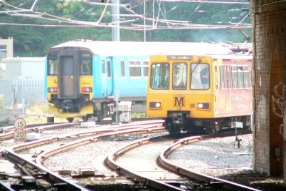 Northern_Rail_156463_and_Tyne_and_Wear_Metro_4060.jpg
